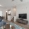 a living room with a tv and couches