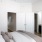 a bedroom with a bed and a mirror