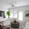 a living room with a tv and couches