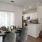 a large kitchen with a dining table